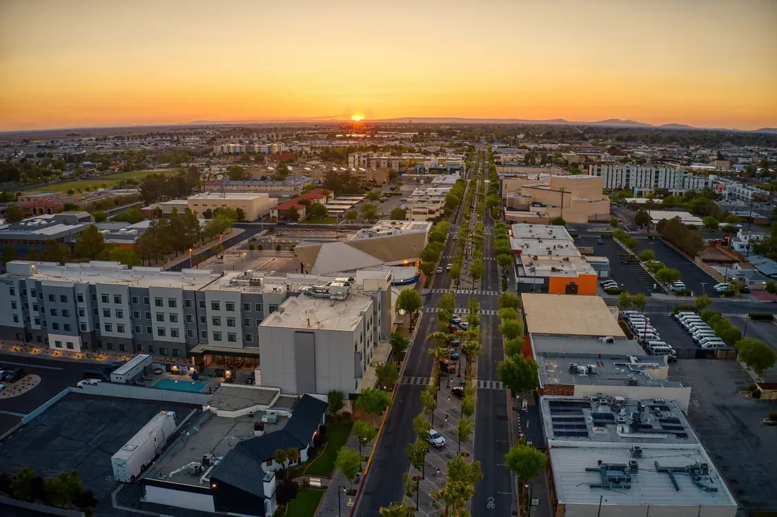 Aerial view of commercial roofs in Lancaster, California at sunset